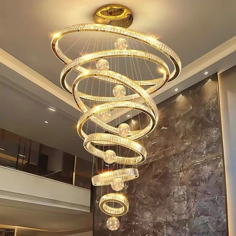 Cascading golden crystal rings illuminating a double-height interior